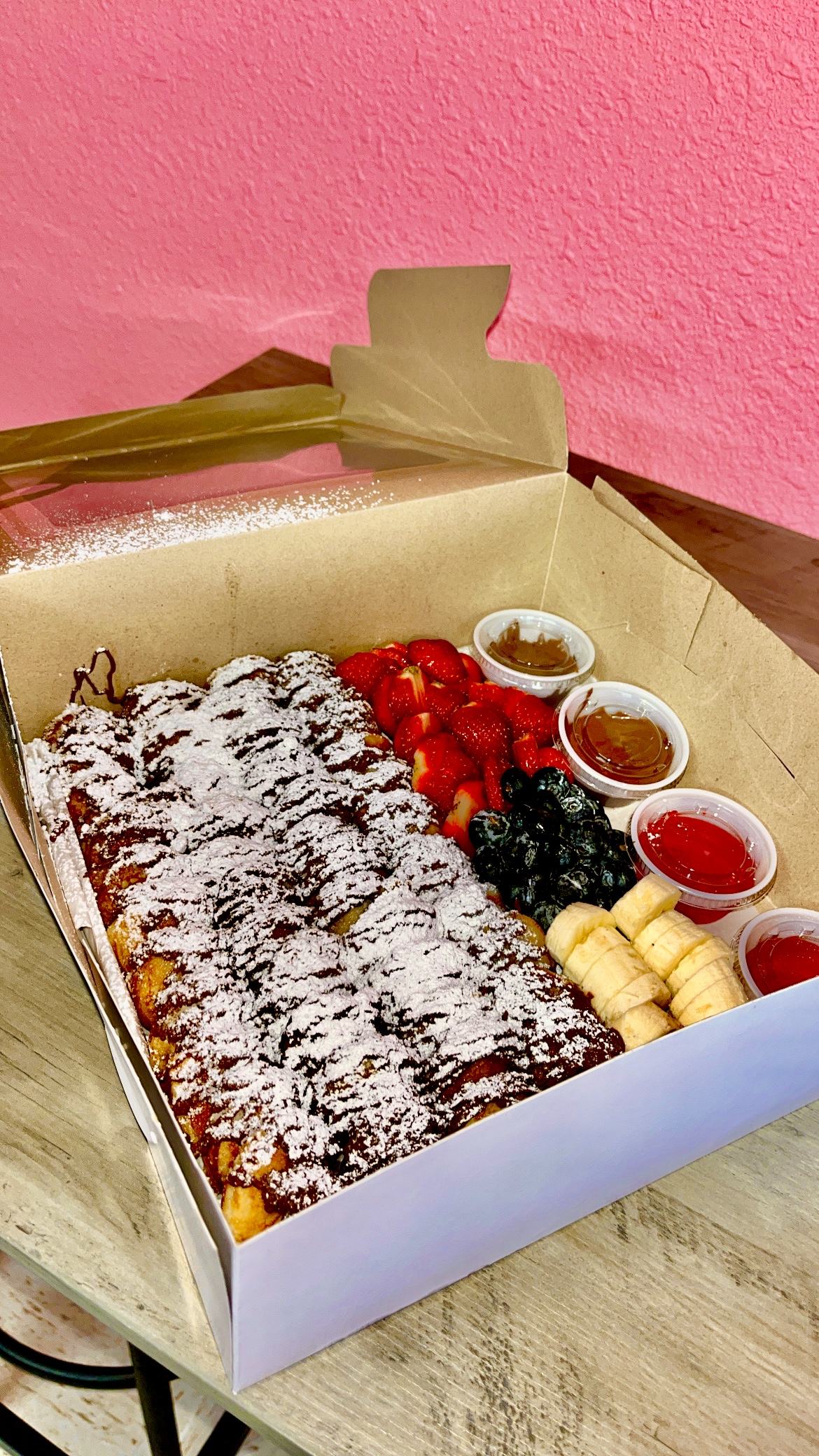 Boxed mini pancakes with Nutella and fresh fruit